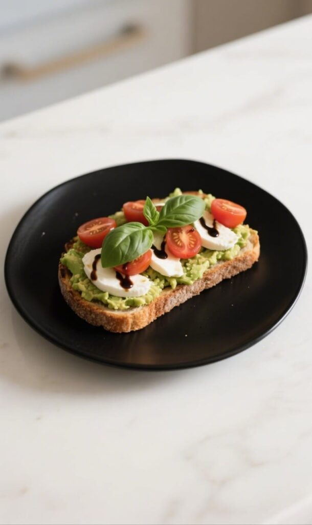 Caprese Avocado Toast Recipe with fresh basil and mozzarella

